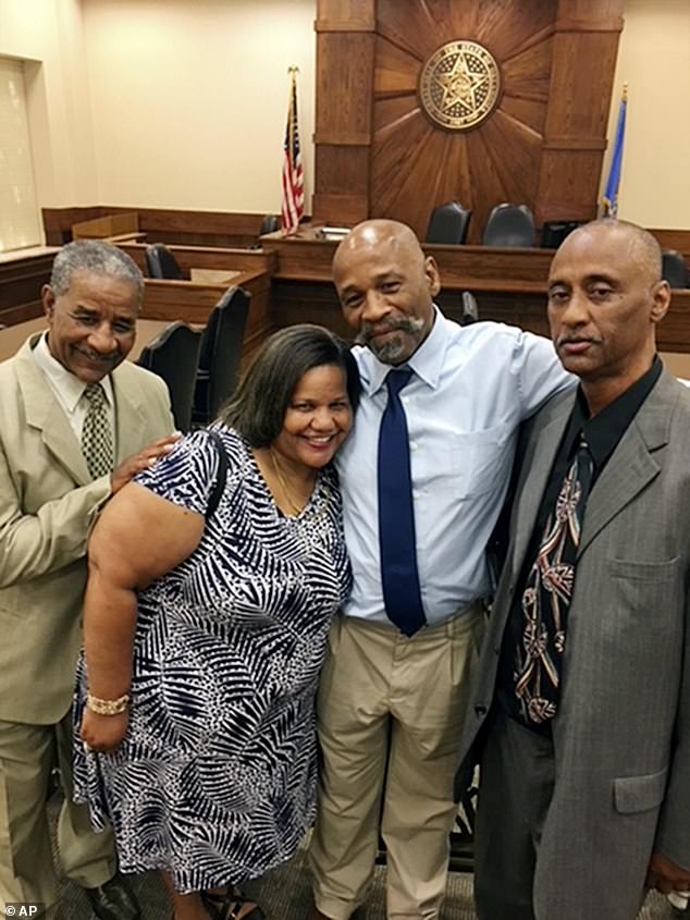 Lott inside a courtroom in Oklahoma City, July 9, 2018, with his brother Steve Lott, left;  sister Tammy Lott, center;  and brother Willie Lott, right;  after being released from prison