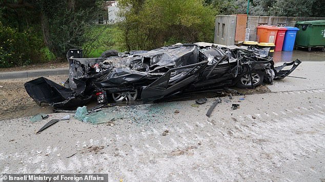 Cars were left flattened in the middle of the road in Be'eri, which is just a few miles from the Gaza border.