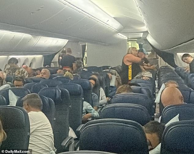 Passengers seen waiting on the plane before take off to Chicago
