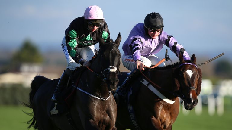 Strong Leader (left) breaks away from Jaramillo at Aintree