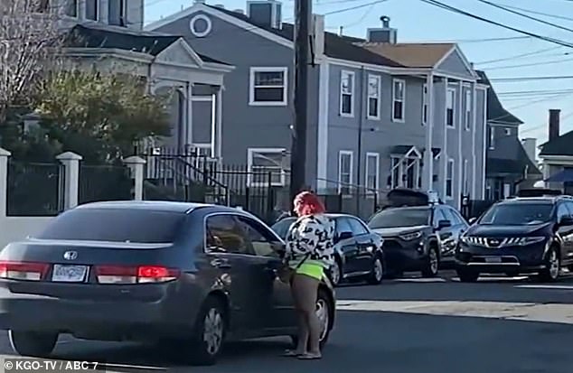 Shocking footage shows women who appear to be prostitutes soliciting clients right outside a Catholic elementary school in Oakland