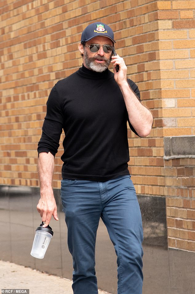 Hugh talked about the excessive attention in recent months as he walked around the Big Apple.  Hugh was seen holding an empty protein shaker in his hand.  On the picture