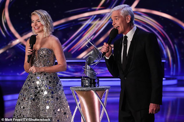 In the dark: Before Holly's departure, she was set to present the program despite former co-host Philip Schofield's dramatic exit from ITV after he admitted lying about an affair with a younger colleague back in May (pictured with Phil at DOI 2023 )