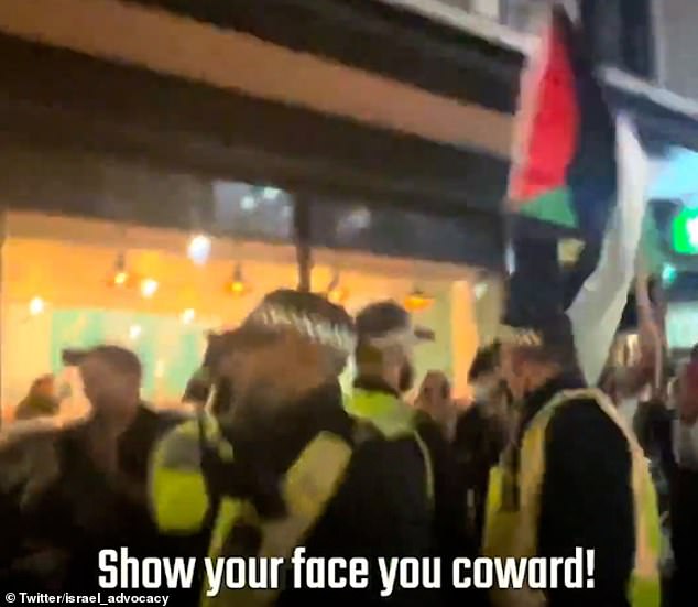 Another shouted: 'Show your face, you coward!'