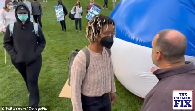 After accusing a man of being 'transphobic', one of the activists knocked over a table.