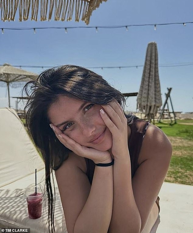 Ravit strikes a pose on a sun lounger.  At his funeral in Ashdod, southern Israel, on Monday night, his commanding officer praised the teenage officer for his bravery.