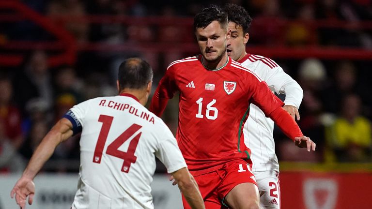 Wales' Liam Cullen runs at Gibraltar's Roy Chipolina