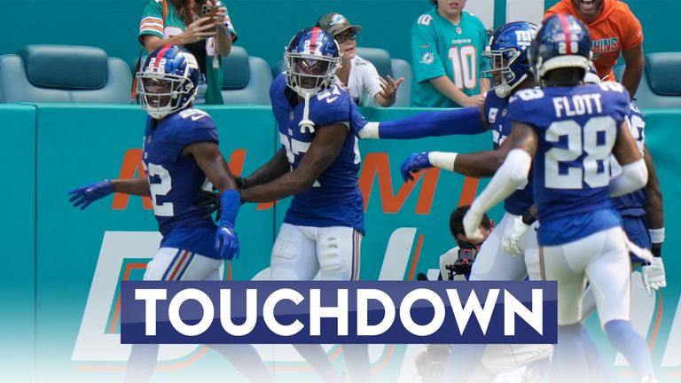 New York Giants safety Jason Pinnock drives downfield for a 102-yard pick-six as linebacker Bobby Okereke sends Tua Tagovailoa's pass into Pinnock's waiting hands.