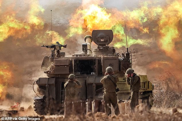 An Israeli army self-propelled howitzer fires near the border with Gaza in southern Israel on October 1