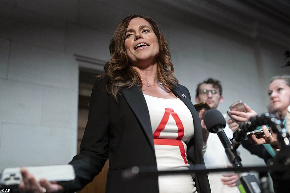 The Liberal MP attended an all-conference meeting on Tuesday night wearing a white T-shirt with a red 'A' on it.  