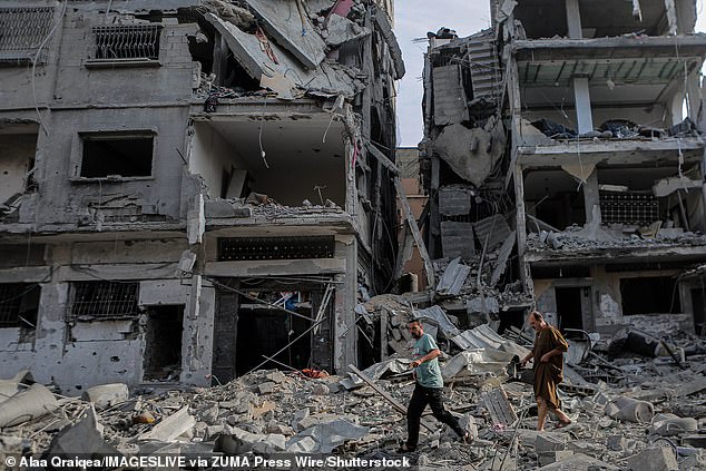 Displaced Palestinians are pictured on Wednesday after intensive Israeli raids in the al-Karama district in northwestern Gaza