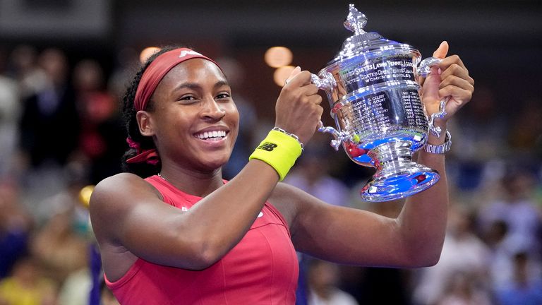 Coco Gauff of the United States holds up the championship trophy after defeating Aryna Sabalenka of Belarus in the women's singles final of the U.S. Open tennis championships, Saturday, September 9, 2023, in New York.  (AP Photo/Frank Franklin II)