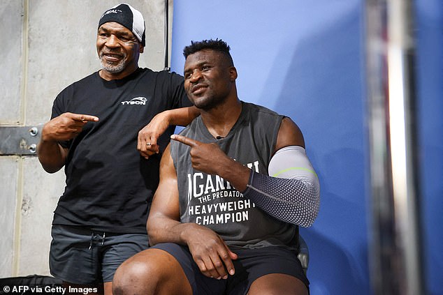 John said there was no bad blood despite Mike Tyson (left) - who he named his son after - being in Francis Ngannou's corner for his upcoming fight against Tyson Fury.