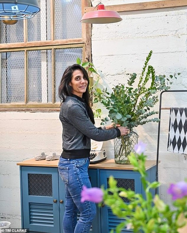 Yonat holding a plant.  While Mr Besorai's elderly father and his older sister were rescued hours later by the Israeli army, there was no sign of Yonat (50), her husband Dror (50) and two of their three children, Noam (15) and Alama (13 )