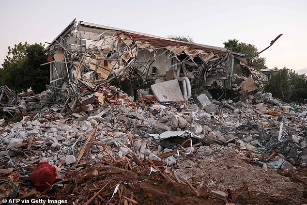 A photo taken on October 11, 2023 shows a destroyed house at the scene of last weekend's inflitation by Palestinian militants on Kibbutz Beeri near the border with Gaza