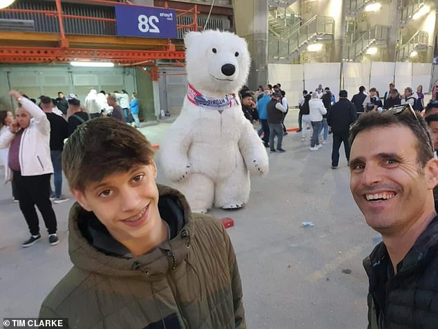 Dror and one of their children smile in the street.  'My father was rescued by soldiers after 13 hours.  My sister Noat was rescued after 24 hours.  But there was no sign of Yonat,' Mr Besorai said, referring to his other sister