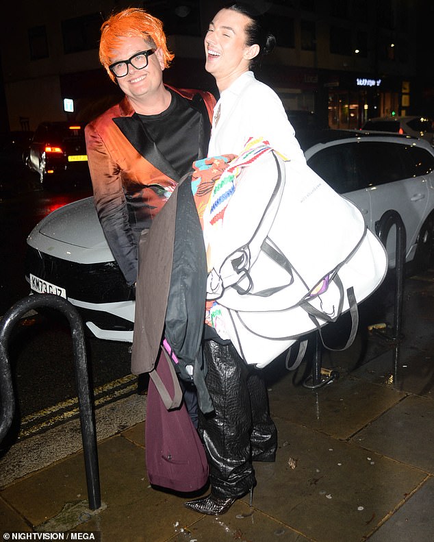 OK, sure: Alan Carr was rocking a red wig when he was photographed on the street later