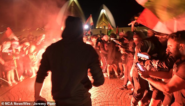 There were scenes of chaos as the demonstration was hijacked by radical Muslims - some wearing black masks - who threw flares at police and chanted 