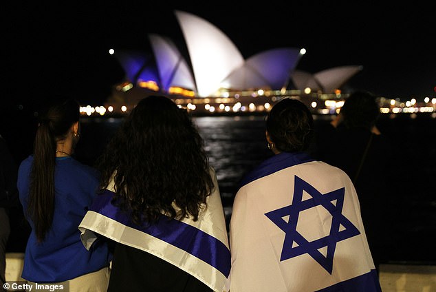 Sydney Opera House lit up in blue and white in support of Israel