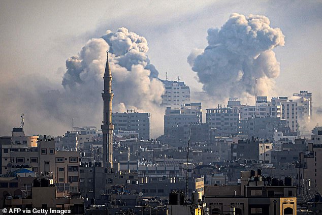 Plumes of smoke billow during Israeli airstrikes in Gaza City on October 12, 2023