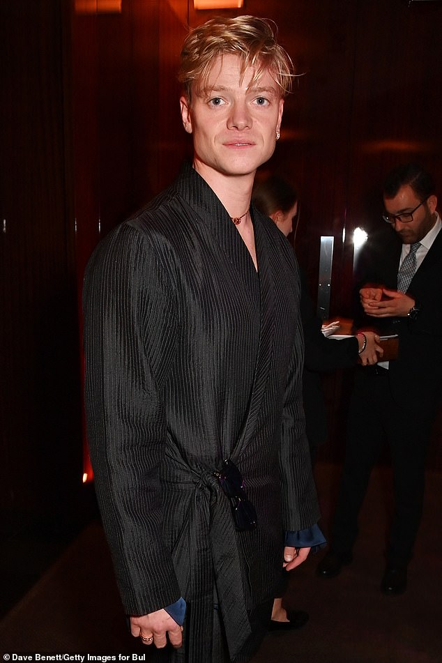 Fashion: Tom Rhys Harris showed off his sense of style in a wrap top