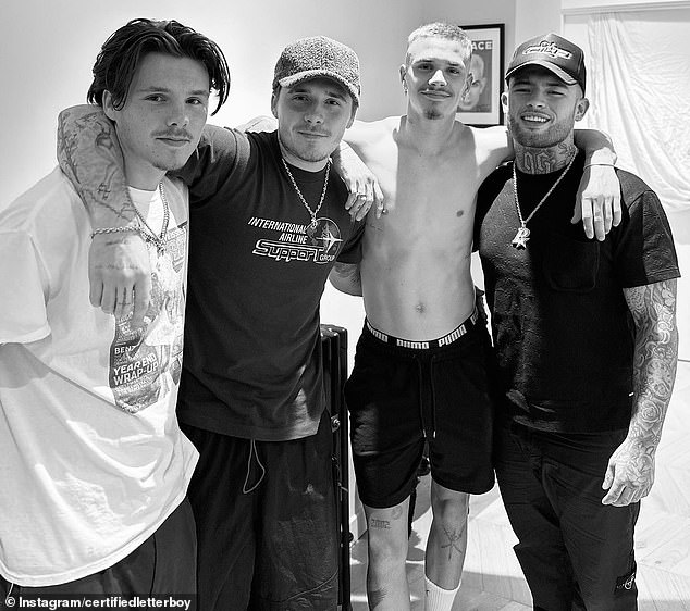 Keeping it in the family: The Beckham brothers have marked the strong bond they share as siblings by getting matching tattoos