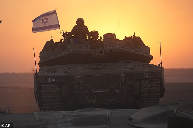 Israeli tanks move toward the border with the Gaza Strip in southern Israel on Thursday