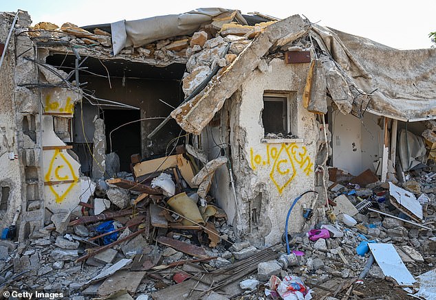 A house left in ruins after an attack by Hamas militants on this kibbutz days earlier when dozens of civilians were killed near the border with Gaza.