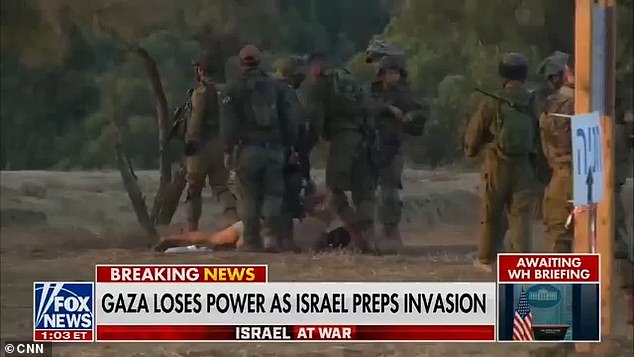 IDF soldiers are seen overpowering the Palestinian man on Thursday