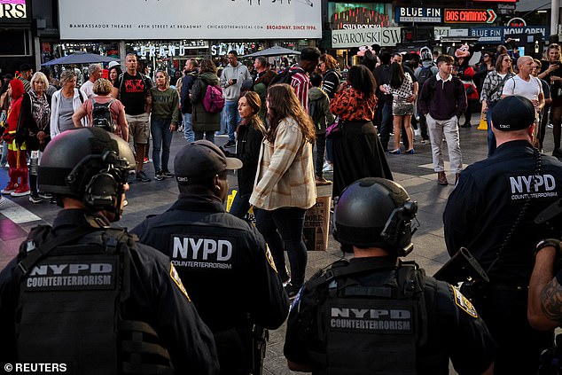 Members of the New York Police Department's counterterrorism unit patrol Times Square on Thursday.  A former Hamas leader called for a 'Day of Jihad' on Friday