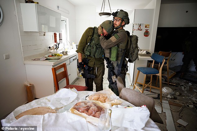 Soldiers crying at the sight of a family dining table still with Challah bread from Friday's Kiddush