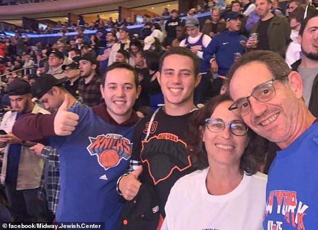 Omer at a sporting event with his parents and brother