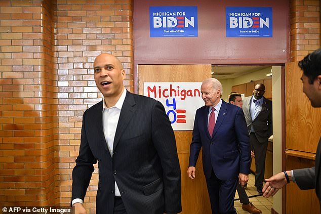 Senator Cory Booker (left) joined Joe Biden at a 2020 campaign stop.  Now Romney has encouraged Booker to challenge Biden for the White House