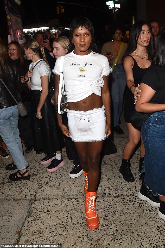 Cute: Richie Shazam wears a white top with a front knot and a matching white mini skirt