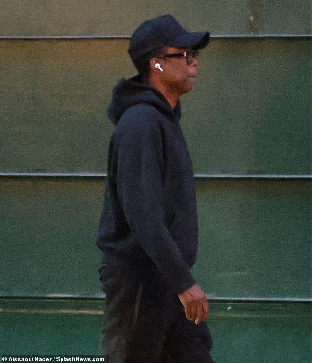 Low key: The star wore a casual outfit, black-rimmed glasses and a baseball hat for the outing