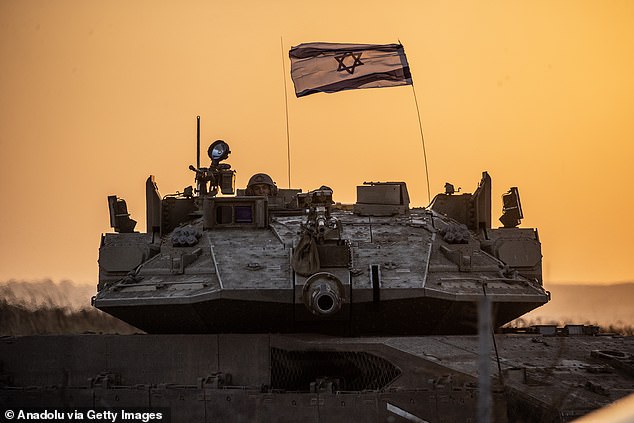 Israeli tanks move near the Gaza border as the Israeli army deploys military vehicles around the Gaza Strip, Israel on October 12, 2023