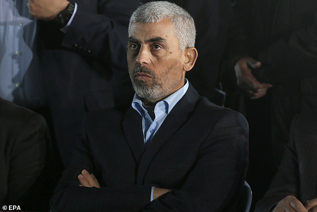 One of the buildings, he said, was being used by the brother of Hamas chief Yahya Sinwar (pictured, file photo).  Muhammad Sinwar is believed to have been inside the building