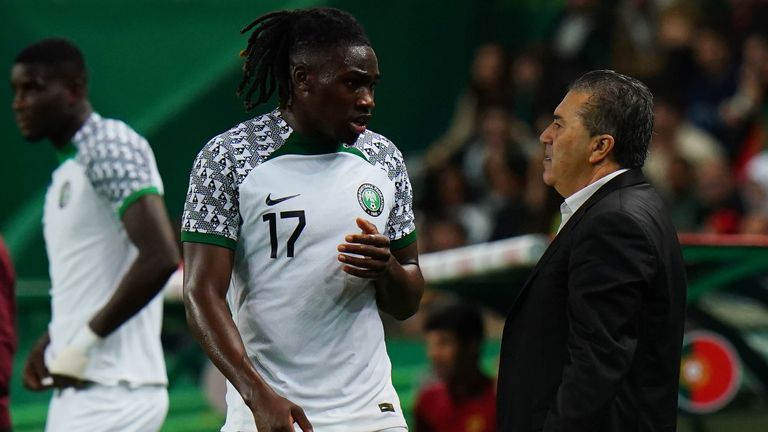 LISBON, PORTUGAL - NOVEMBER 17: José Peseiro of Nigeria talks with Calvin Bassey of Nigeria during the international friendly match between Portugal and Nigeria at Estadio Jose Alvalade on November 17, 2022 in Lisbon, Portugal.  (Photo by Gualter Fatia/Getty Images)