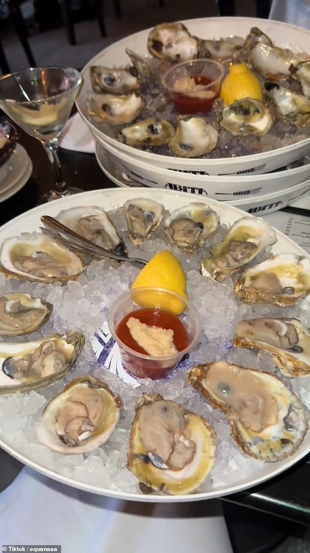 As she slurped the oysters, the woman also added lemon and hot sauce