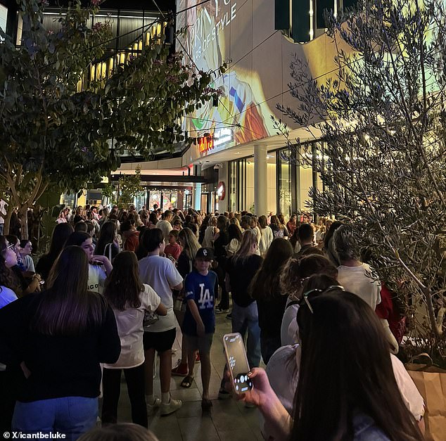 Patrons at Hoyts bars, restaurants and cinemas were ordered to leave around 8pm (pictured, evacuees waiting outside the centre)