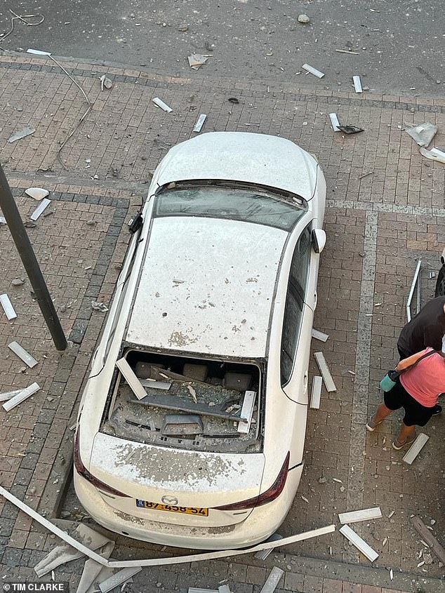 Debris on a car parked outside Steve's apartment in Ashkelon.  Residents of Ashkelon are given just 15 seconds to take cover after air raid sirens warn of incoming missiles.