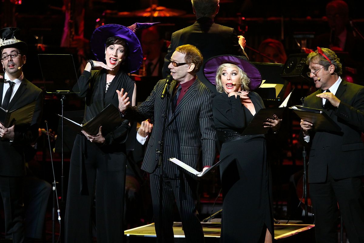 Danny Elfman and a few other singers wear the evening and dressed in black and white for the Tim Burton Halloween movie concert