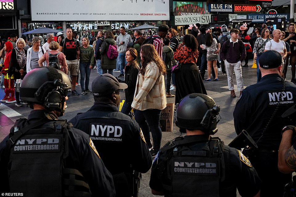 Members of the New York City Police Department's (NYPD) counterterrorism unit patrol in Times Square, as the city takes security measures ahead of planned protests, in New York City, USA, October 12, 2023