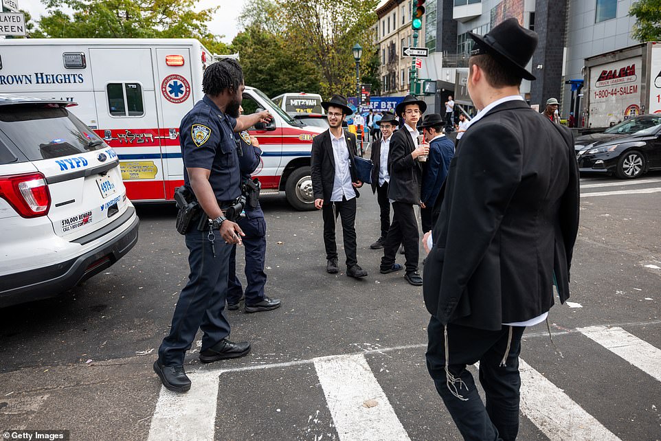 Police patrol a Brooklyn neighborhood with a large Orthodox Jewish community on October 12, 2023 in New York City.  Across New York City and much of the country, security has increased around synagogues and other Jewish cultural institutions following last weekend's Hamas attacks in Israel