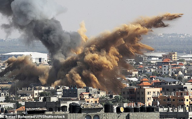 Smoke rises above buildings in the southern Gaza Strip after an Israeli attack today