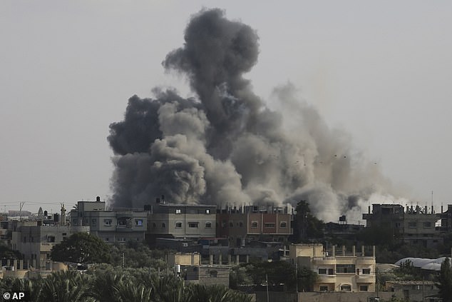 Smoke rises from an explosion caused by Israeli airstrikes on the border between Egypt and Rafah, in the Gaza Strip, on Tuesday