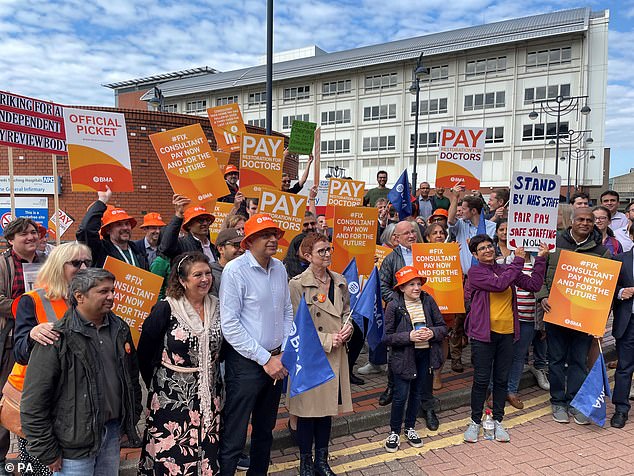 The British Medical Association says consultants should charge at least £215 an hour for overtime outside Monday to Friday between 7am and 7pm.  This means they will benefit from record NHS waiting lists, which have risen to 7.75 million as a result of the Covid-19 pandemic and strikes.  Pictured: NHS consultants on picket line outside Leeds General Infirmary in July 2023