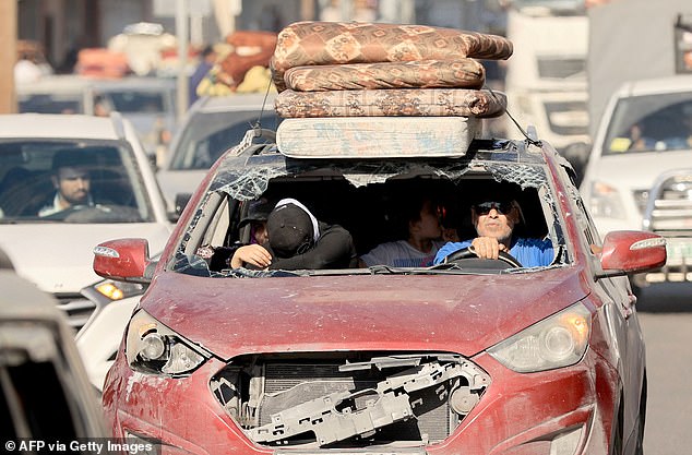 Palestinians in Gaza City flee for their lives after Israel's evacuation order to the north