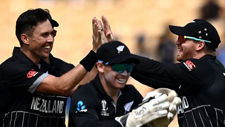 Trent Boult (L) celebrates with his teammates after taking the wicket of Bangladesh's Liton Das during the 2023 ICC Men's Cricket World Cup (ODI) One-Day International match between New Zealand and Bangladesh 