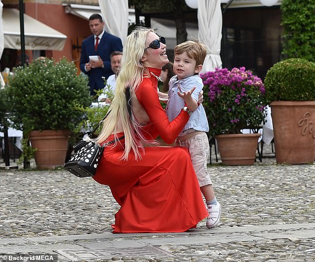 Grimes (pictured with X in Portofino in July) recently begged Musk to let her see her son in a now-deleted post aimed at his current partner Shivon Zilis